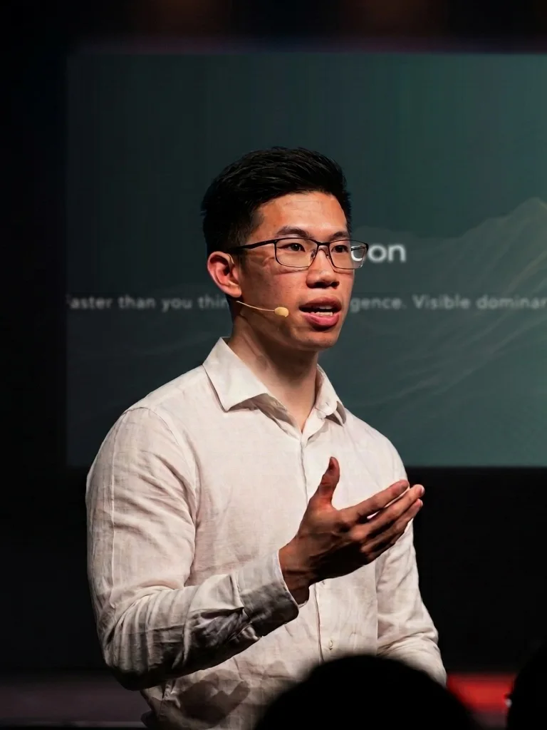 Norton, founder of Reputcon, speaking on stage